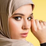 beautiful young arab woman stylish hijab isolated yellow background with copyspace