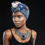 stunning beautiful young stylish black woman isolated black wall
