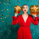 attractive shocked woman stylish red dress celebrating christmas new year with gifts