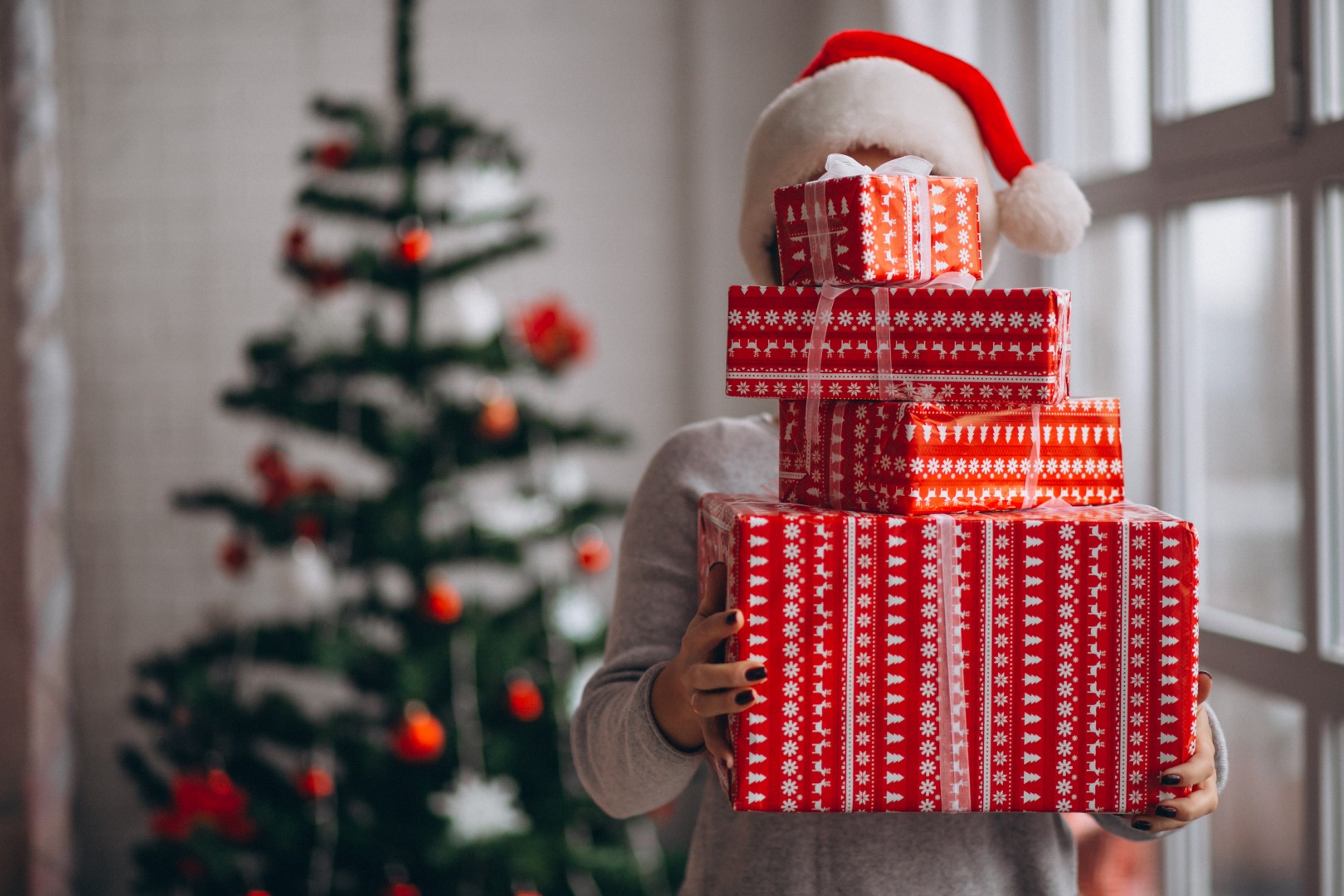 woman holding big christmas